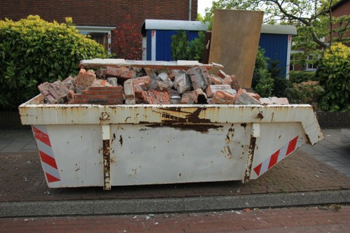 Enclosed and lockable skip placed in a residential area of Kentish Town