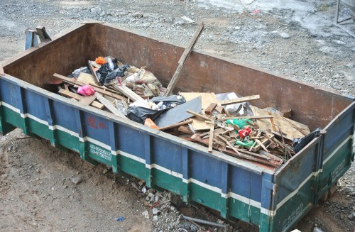 Residential area in Kentish Town with a skip for waste disposal