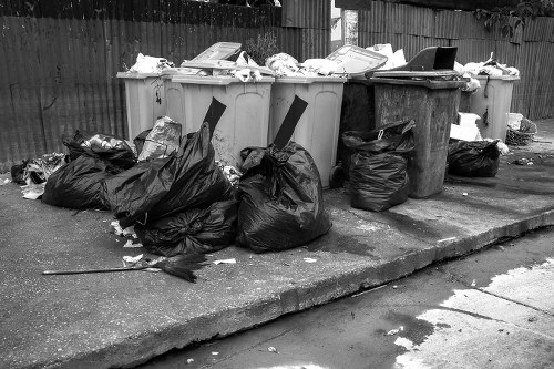 Family organizing household waste with a hired skip in Kentish Town