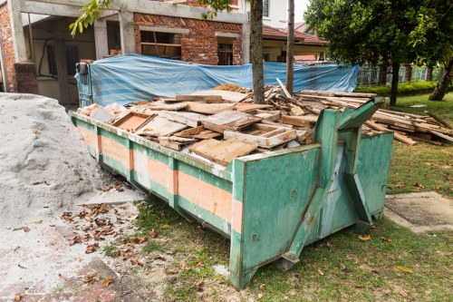 Gardener removing garden waste in Kentish Town