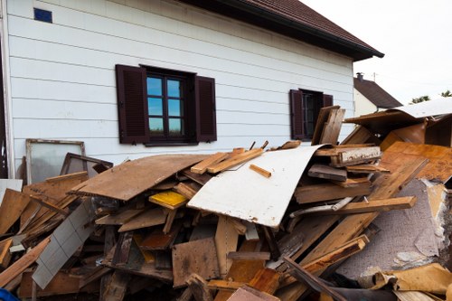 Cluttered garage being cleared by professionals